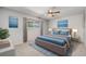 Main bedroom with carpeted floors, ceiling fan, and large window at 9026 E Mansfield Ave, Denver, CO 80237