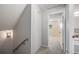 Upper hallway with linen closet and access to bedrooms at 9026 E Mansfield Ave, Denver, CO 80237