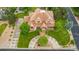 An aerial view of a stunning property with lush landscaping, a circular driveway, and a grand entrance at 14154 Lexington Cir, Westminster, CO 80023