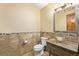 A well-designed powder room featuring rustic finishes and neutral earth tones at 14154 Lexington Cir, Westminster, CO 80023