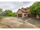 A gorgeous home featuring a brick exterior, three-car garage, and a basketball court at 14154 Lexington Cir, Westminster, CO 80023