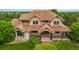 Beautiful front exterior view of a two-story home featuring manicured landscaping and a covered entryway at 14154 Lexington Cir, Westminster, CO 80023