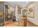 Open concept kitchen island with unique stone accents and wood cabinetry at 14154 Lexington Cir, Westminster, CO 80023