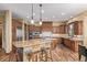 Gourmet kitchen features granite countertops, custom cabinets, and stainless steel appliances at 14154 Lexington Cir, Westminster, CO 80023