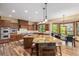 Gourmet kitchen features granite countertops, custom cabinets, and stainless steel appliances at 14154 Lexington Cir, Westminster, CO 80023