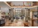 Spacious living room with stone fireplace, large windows, and open floor plan at 14154 Lexington Cir, Westminster, CO 80023