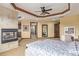 Beautiful main bedroom with a fireplace, access to the bathroom, and views of the ensuite facilities at 14154 Lexington Cir, Westminster, CO 80023