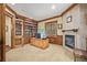 A spacious office with a fireplace, bookshelves, and detailed wood trim at 14154 Lexington Cir, Westminster, CO 80023