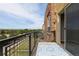 Balcony with a blue patterned rug and scenic views of the surrounding neighborhood and mountains at 9019 E Panorama Cir # D418, Englewood, CO 80112