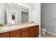 Bathroom featuring double sink vanity and a large mirror at 9019 E Panorama Cir # D418, Englewood, CO 80112