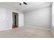 Bright bedroom with carpet floors and closet with sliding doors at 9019 E Panorama Cir # D418, Englewood, CO 80112