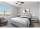 Cozy bedroom with neutral decor, a large window, and stylish furnishings at 9019 E Panorama Cir # D418, Englewood, CO 80112