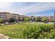 Expansive community lawn surrounded by residential buildings and parked cars at 9019 E Panorama Cir # D418, Englewood, CO 80112
