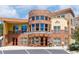 Stylish brick building exterior with awnings and a landscaped entrance at 9019 E Panorama Cir # D418, Englewood, CO 80112