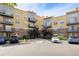 Attractive condo building exterior with balconies and convenient parking at 9019 E Panorama Cir # D418, Englewood, CO 80112