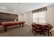 Well-lit game room with a pool table and card table for entertainment at 9019 E Panorama Cir # D418, Englewood, CO 80112