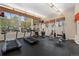 Well-equipped gym with various exercise machines and large windows at 9019 E Panorama Cir # D418, Englewood, CO 80112