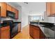 Modern kitchen featuring granite countertops and stainless steel appliances at 9019 E Panorama Cir # D418, Englewood, CO 80112