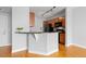 Bright kitchen featuring an island/peninsula with seating and modern lighting fixtures at 9019 E Panorama Cir # D418, Englewood, CO 80112
