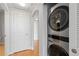 Convenient in-unit laundry closet with modern stacked washer and dryer at 9019 E Panorama Cir # D418, Englewood, CO 80112