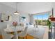 Bright living room featuring a dining area, comfortable seating, and a sliding door to a balcony with scenic views at 9019 E Panorama Cir # D418, Englewood, CO 80112