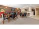 Inviting recreation room with multiple seating areas and neutral carpeting at 9019 E Panorama Cir # D418, Englewood, CO 80112