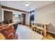Finished basement area with wooden beams, separate bedroom and walk-out door at 7296 S Flower St, Littleton, CO 80128