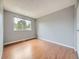 Spacious bedroom offering natural light with wood flooring and ample space at 7296 S Flower St, Littleton, CO 80128
