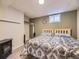 Relaxing bedroom with bed, gray plank flooring, and a closet at 7296 S Flower St, Littleton, CO 80128