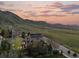 Aerial view of a home with mountain views and backyard spaces at 828 Rabbit Run Dr, Golden, CO 80401