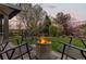 Backyard with a fire pit and chairs, creating a cozy outdoor space for relaxation and gatherings at 828 Rabbit Run Dr, Golden, CO 80401