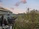 Spacious backyard with a deck, patio, and outdoor seating areas, offering serene views and mountain backdrop at 828 Rabbit Run Dr, Golden, CO 80401