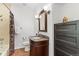 Bathroom features a vanity with granite counters and tiled shower/tub combination at 828 Rabbit Run Dr, Golden, CO 80401