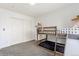 Bedroom featuring a bunkbed, closet and neutral carpet at 828 Rabbit Run Dr, Golden, CO 80401