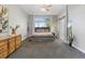 Spacious bedroom with gray walls, carpet, modern decor, and a large window at 828 Rabbit Run Dr, Golden, CO 80401