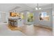 Bright eat-in kitchen features granite counters, light wood cabinetry, and access to the home's backyard at 828 Rabbit Run Dr, Golden, CO 80401