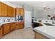 Open kitchen with sleek countertops, light wood cabinetry, stainless steel appliances, and modern finishes at 828 Rabbit Run Dr, Golden, CO 80401