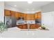 Bright kitchen features stainless steel appliances, granite countertops, and wood cabinetry at 828 Rabbit Run Dr, Golden, CO 80401