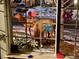 Close up through window with decorated glass, two elk graze outside at 828 Rabbit Run Dr, Golden, CO 80401