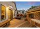 Beautiful backyard deck with seating, outdoor lighting, and brick outdoor kitchen at 840 S Gaylord St, Denver, CO 80209