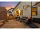 Wide angle shot of the back deck with seating, stairs down to the yard and modern home exterior at 840 S Gaylord St, Denver, CO 80209