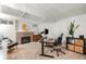 Carpeted basement office space with fireplace, desk, and ambient lighting at 840 S Gaylord St, Denver, CO 80209