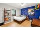 Cozy bedroom with unique accent wall and natural light at 840 S Gaylord St, Denver, CO 80209
