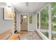 Inviting entryway with tiled floor, lots of light, and views to the exterior through many large windows at 840 S Gaylord St, Denver, CO 80209