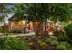 Charming home featuring a well-maintained front yard and landscaped garden at 840 S Gaylord St, Denver, CO 80209