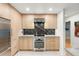 Modern kitchen features light wood cabinets and a stainless steel oven at 840 S Gaylord St, Denver, CO 80209