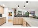 Open-concept kitchen with stone countertops that overlook the living area at 840 S Gaylord St, Denver, CO 80209