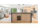 Contemporary kitchen features an island with seating and a built-in wine fridge at 840 S Gaylord St, Denver, CO 80209