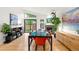 Bright living room and dining area with hardwood floors and lots of natural light at 840 S Gaylord St, Denver, CO 80209