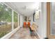 Bright sunroom with tile floors and lots of windows at 840 S Gaylord St, Denver, CO 80209